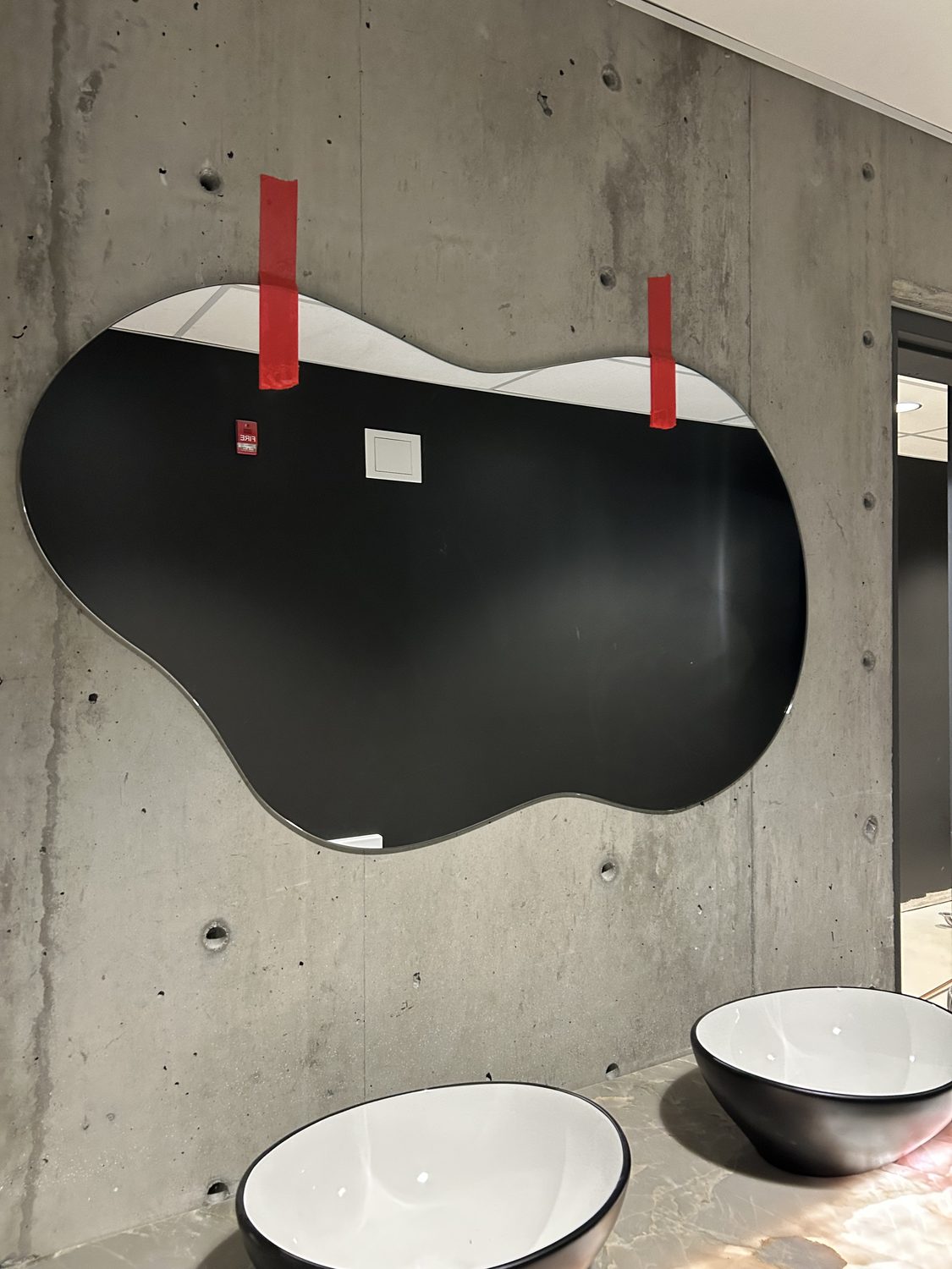 Custom-cut feature mirror over a double vanity